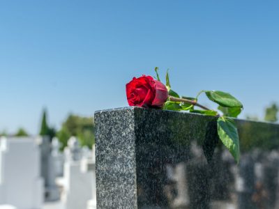 Gravestone with withered rose